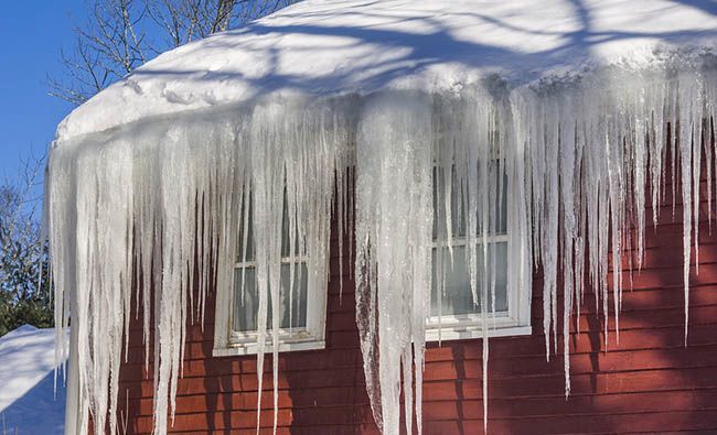 A Rooftop Covered With Snow And Ice