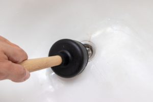 use-plunger-to-clean-bathtub-hair-drain