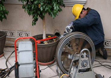 Plumber Performing Rooter Services