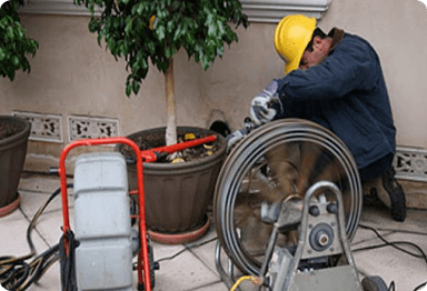 Plumber Performing Rooter Services
