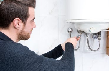 Plumber With A Hot Water Heater